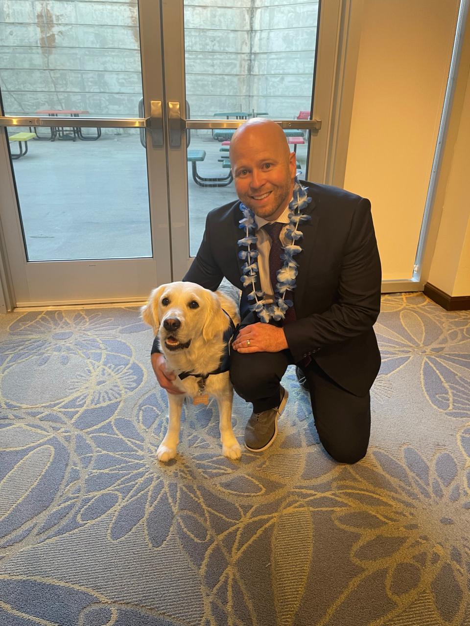 Here with Dr. Matthew B. McDonald III, Children's Specialized Hospital president and CEO, Maui, is the newest staff member and ready to get to work. With "big paws to fill," the 22-month-old English Cream Golden Retriever is the facility's new therapy dog and will continue the work of Burton, who passed in June after an illness.