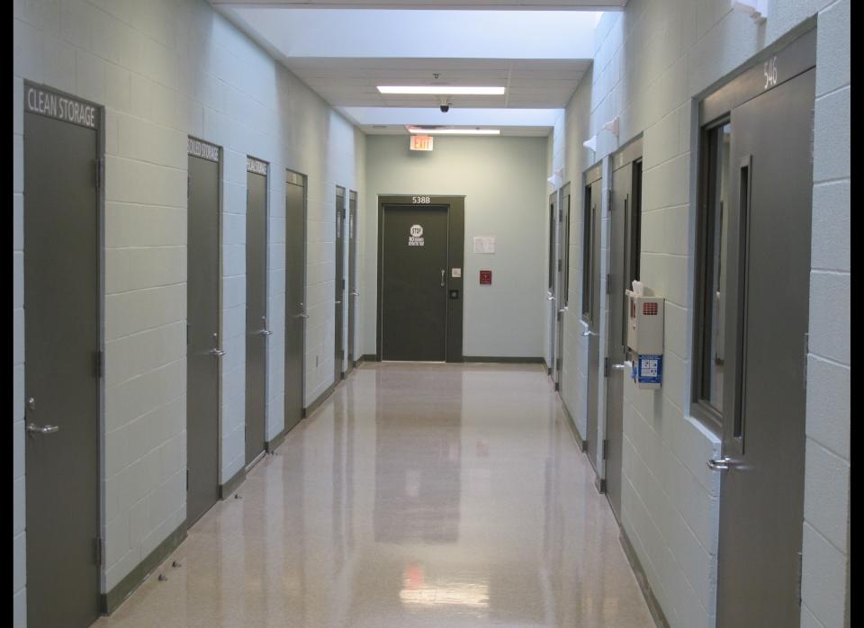 A hallway near the medical and dental clinics at a new civil detention facility for low-risk inmates in Karnes City, Texas, on Tuesday, March 13, 2012. Federal officials are holding up the new facility as the centerpiece of an initiative to treat those facing immigration violation charges more humanely after lawsuits filed in past years. (AP Photo/Will Weissert)