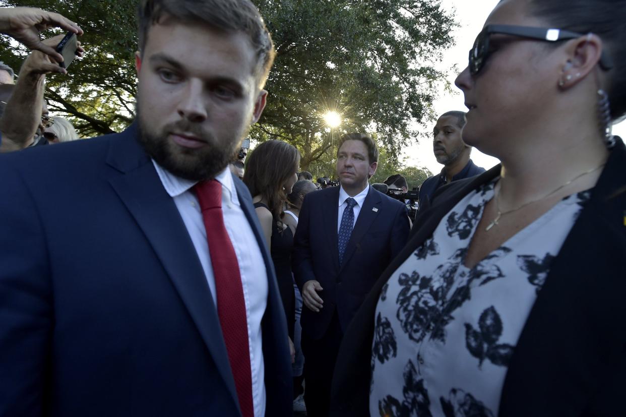 Gov. Ron DeSantis is escorted from the crowd by his security personnel after an Aug. 27 prayer vigil for the Dollar General shooting victims.