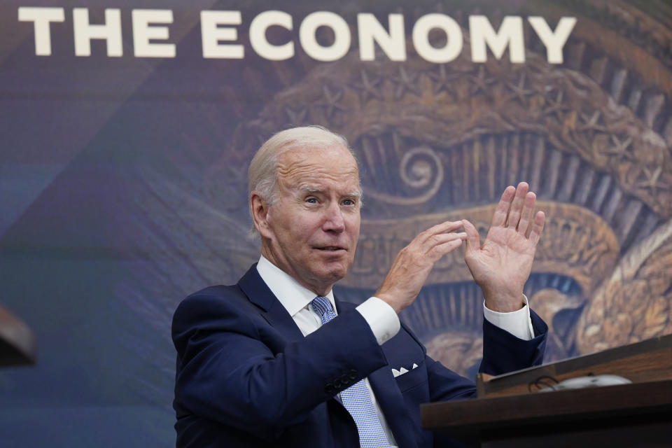President Biden gestures with his hands as he speaks about the economy.
