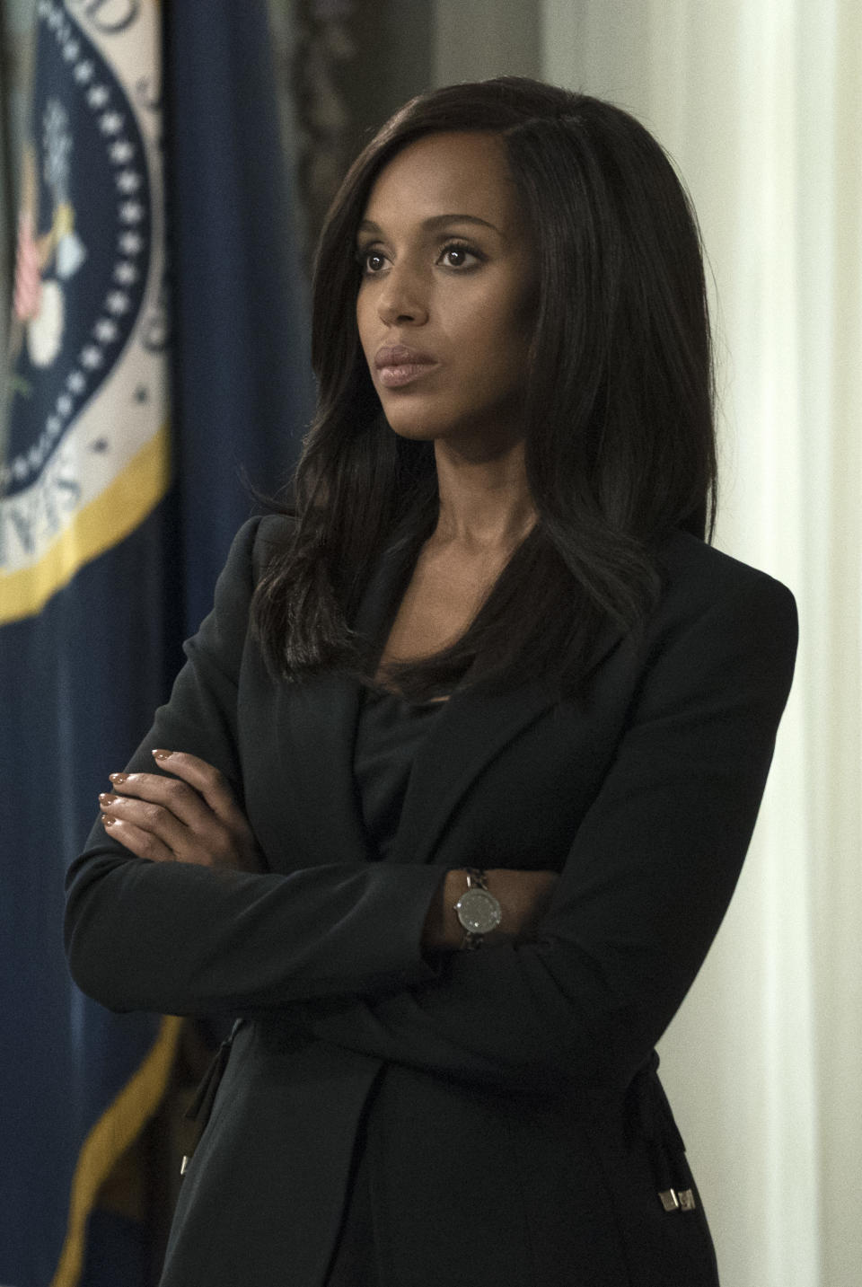 Kerry as Olivia Pope on Scandal standing with her arms folded