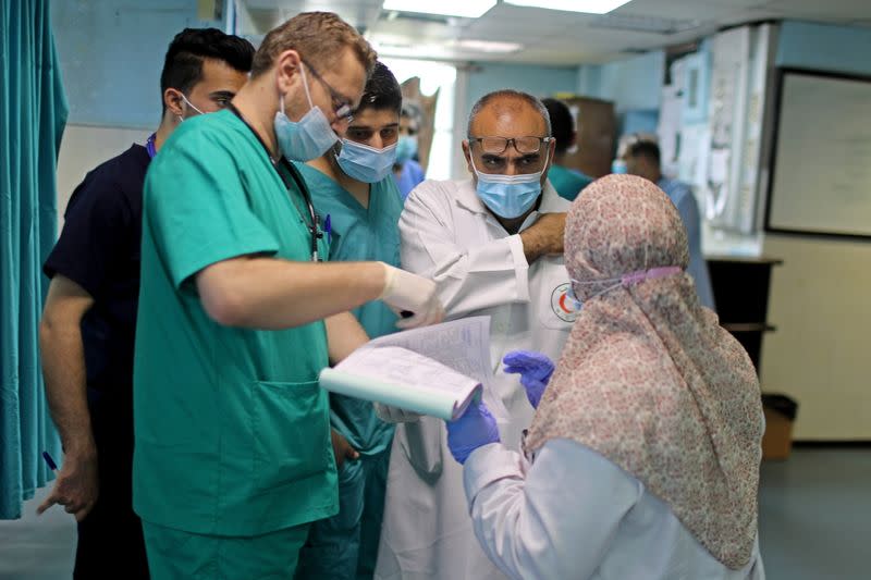 Gaza health system fight on two fronts, Covid-19 and war with Israel