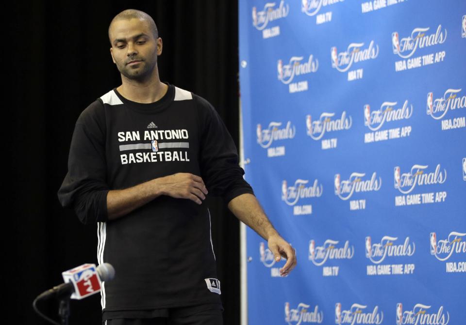 San Antonio Spurs guard Tony Parker arrives for a press conference during practice on Friday, June 6, 2014, in San Antonio. The team plays Game 2 of the NBA Finals against the Miami Heat on Sunday. (AP Photo/Tony Gutierrez)