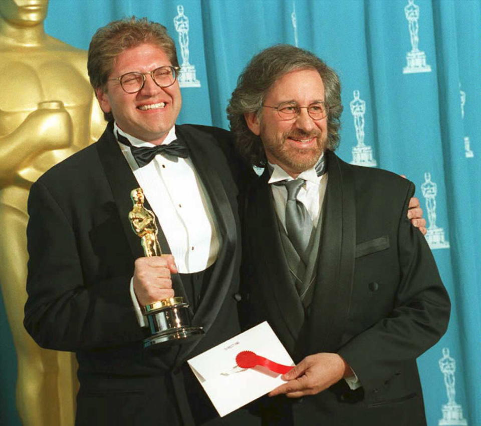 Director Robert Zemeckis (L) holds the Oscar he won as best director for the film Forrest Gump, which also won Best Picture, as he poses with Steven Spielberg. (Dan Groshong/AFP via Getty Images)