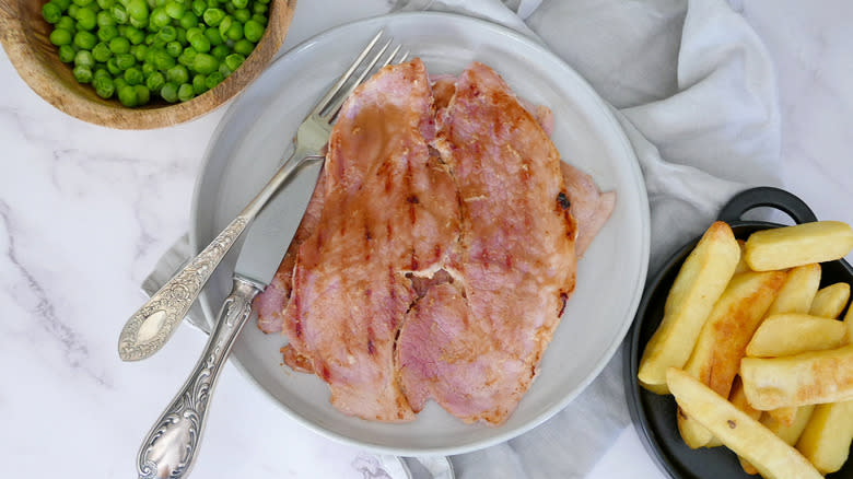 ham steak on white plate