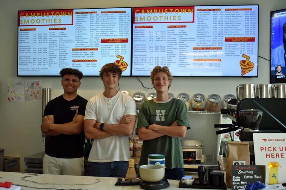 Campustown Smoothies and Sandwich Stop are teaming up to do business at 200 Stanton Ave. in Campustown. Owners are, left to right, Derek Papin, owner of the smoothie shop, NJ Savage, Lukas Savage and, not pictured, Nikoli Savage of the sandwich business.