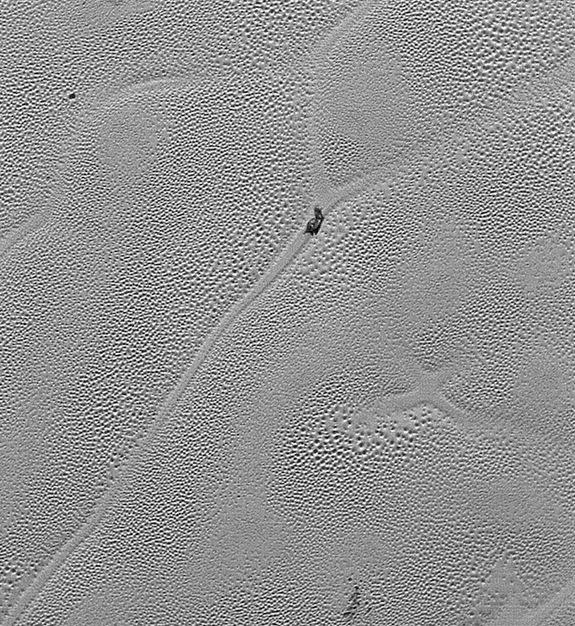 NASA's New Horizons spacecraft captured this image of an intriguing "X" on Pluto's icy Sputnik Planum region; the X probably marks a spot where four separate “cells” of nitrogen ice came together.