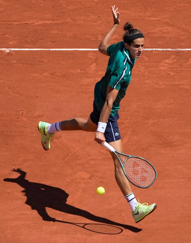 Pierre-Hugues Herbert of France leaps into a backhand during his five-set loss to Jannik Sinner