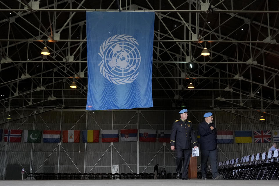 Military Police officers serving with the United Nations peacekeeping force (UNFICYP) in ethnically-divided Cyprus walk during a parade marking the 60th anniversary of the force's inception, inside a U.N. controlled buffer zone that separates breakaway Turkish Cypriots in the north and Greek Cypriots in the internationally recognized south, on Monday, March 4, 2024. More than 150,000 peacekeepers from 43 countries have served with UNFICYP since 1964 with 187 soldiers and staff losing their lives while serving with the mission. (AP Photo/Petros Karadjias)