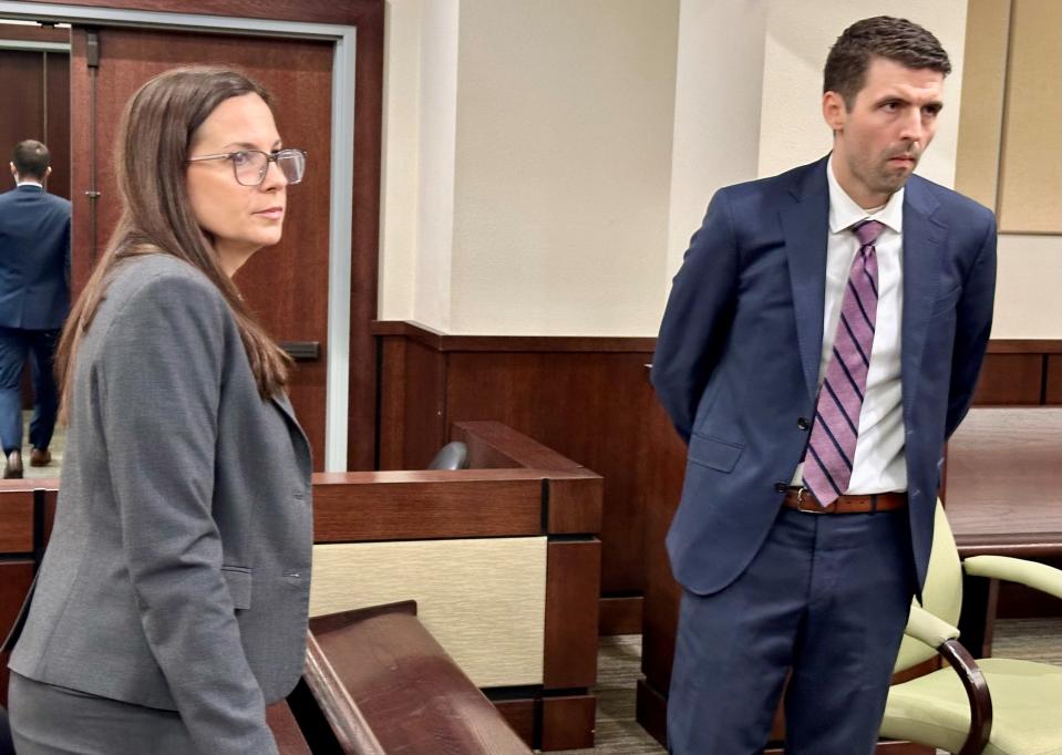 Public Defender Jessica Yeary speaks with Assistant Public Defender Eric Henely during the DUI trial of Calvin Riley Sr. on Friday, April 5, 2024.