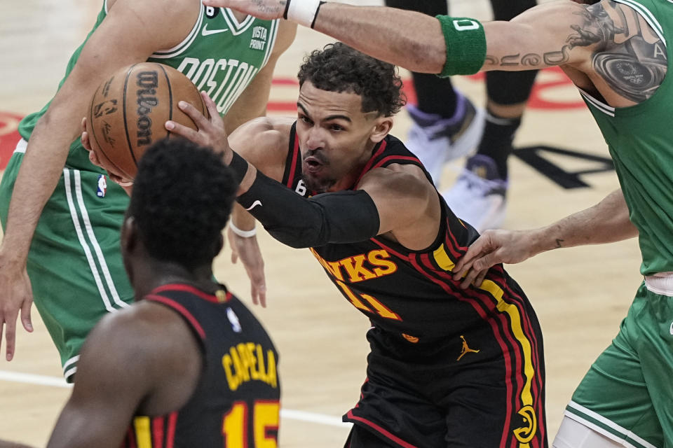 Atlanta Hawks' Trae Young (11) looks to pass the ball against the Boston Celtics during the first half of Game 4 of a first-round NBA basketball playoff series, Sunday, April 23, 2023, in Atlanta. (AP Photo/Brynn Anderson)