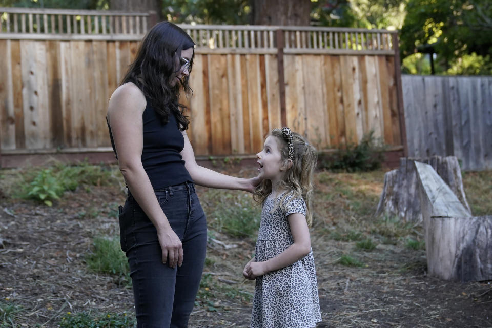 Hannah Levy talks with her daughter, Aylah, 6, at Codornices Park, a location Aylah attended as a Berkeley Forest School student, during an interview in Berkeley, Calif., Wednesday, Nov. 8, 2023. (AP Photo/Jeff Chiu)