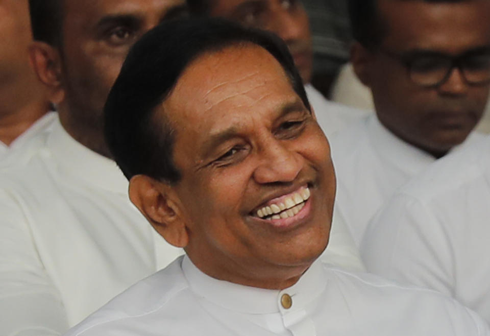 In this Monday, Dec. 23, 2019, photo, former Cabinet minister Rajitha Senaratne participates in a protest in Colombo, Sri Lanka. Sri Lankan police arrested the hospitalized former Cabinet minister on Friday, Dec. 27, for alleged involvement in organizing a news conference about abductions under the government of the current president's brother. Lawyer Gunaratna Wanninayake said Senarathna, now an opposition lawmaker, was arrested at a private hospital where he was admitted on Thursday. (AP Photo/Eranga Jayawardena)
