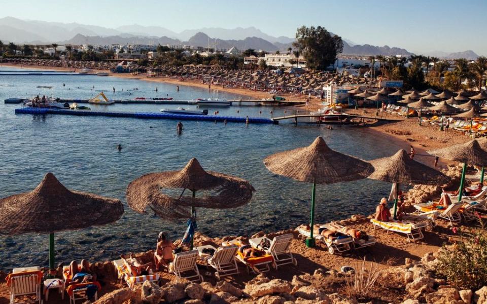 People relax on beach chairs in Sharm El Sheikh - Ed Giles/Getty Images Europe 