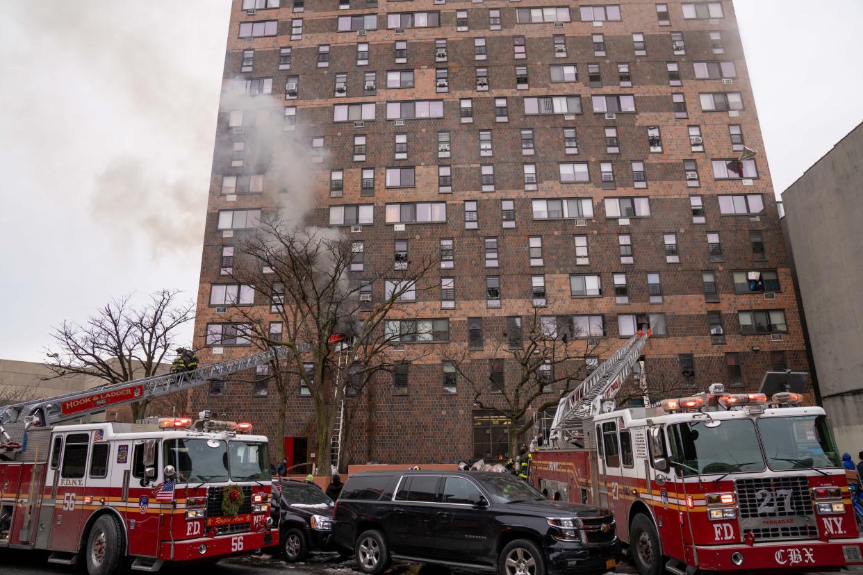Firefighters on the scene of the deadly fire on East 181st Street in the Bronx, New York on January 9, 2022. 