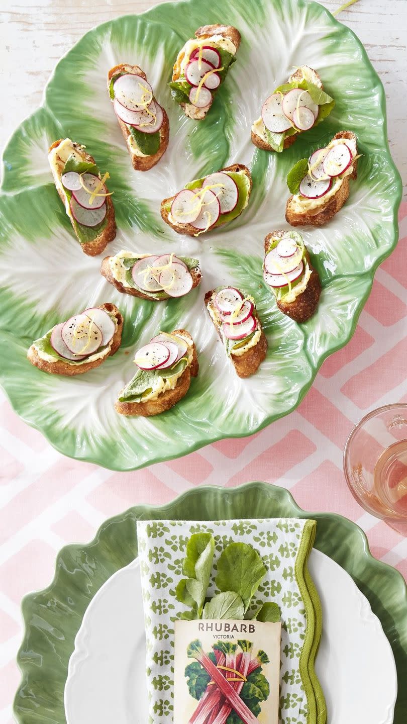 sliced radish and radish leaf toasts with lemon butter arranged on a vintage lettuce shaped plate