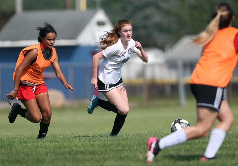 Sarah Lynch, right, pushes the ball upfield during a practice session last August. On Thursday, she was named the Gatorade Rhode Island Girls Soccer Player of the Year.