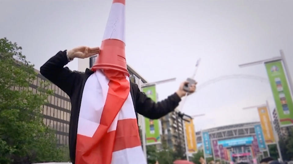 A man with a traffic cone on his head in Netflix's The Final: Attack on Wembley.