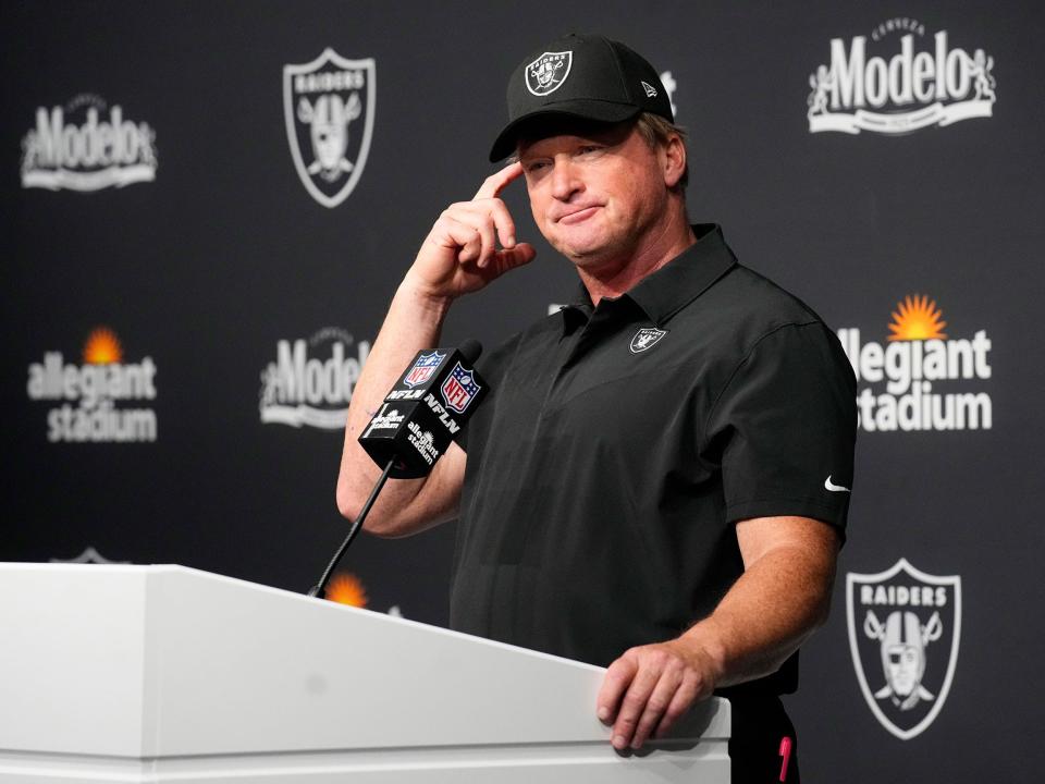 Jon Gruden speaks with reporters after a game against the Miami Dolphins.