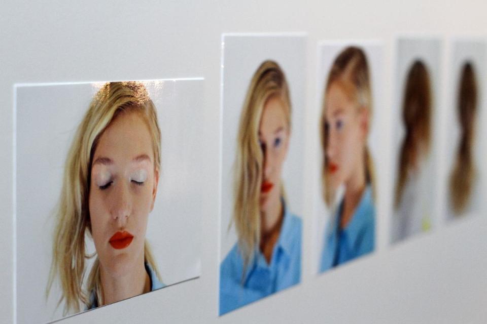 A photo board shows hair and makeup styles backstage at the Creatures of the Wind Spring Summer 2014 collection on Thursday, Sept. 5, 2013, during Fashion Week in New York. (AP Photo/Lisa Tolin)