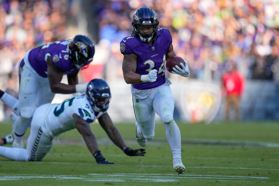 Baltimore Ravens running back Keaton Mitchell runs for a touchdown against the Seattle Seahawks during the third quarter at M&T Bank Stadium.