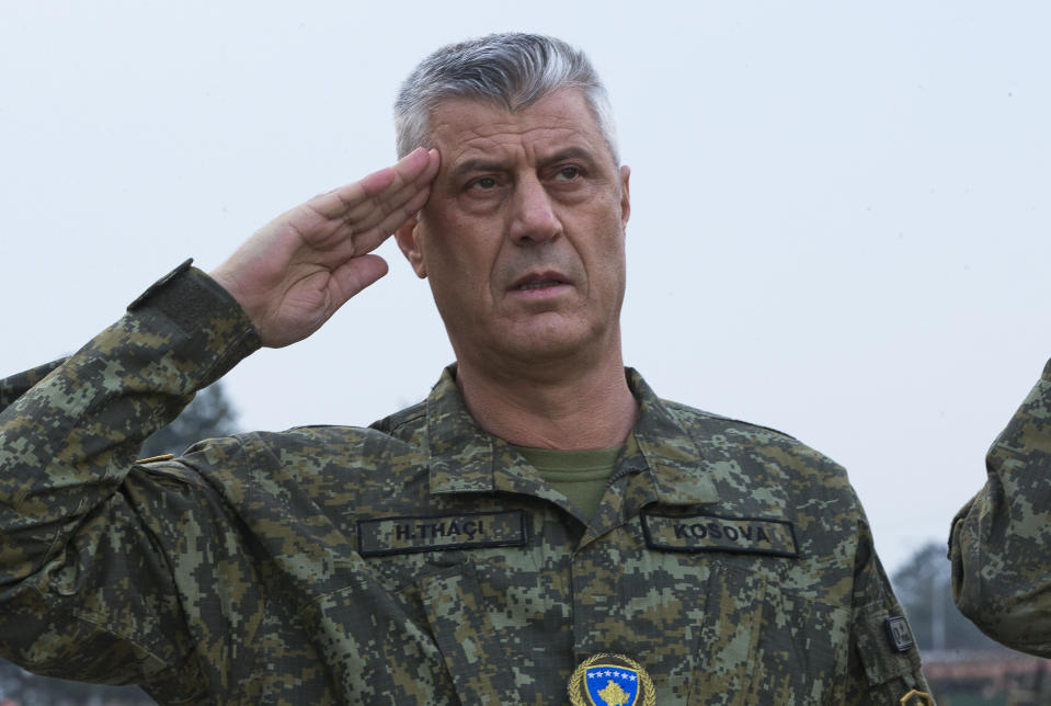 Kosovo president Hashim Thaci salutes as he inspects members of Kosovo Security Force in capital Pristina, Kosovo, on Thursday, Dec. 13, 2018. Kosovo lawmakers are set to transform the Kosovo Security Force into a regular army, a move that significantly heightened tension with neighboring Serbia. (AP Photo/Visar Kryeziu)
