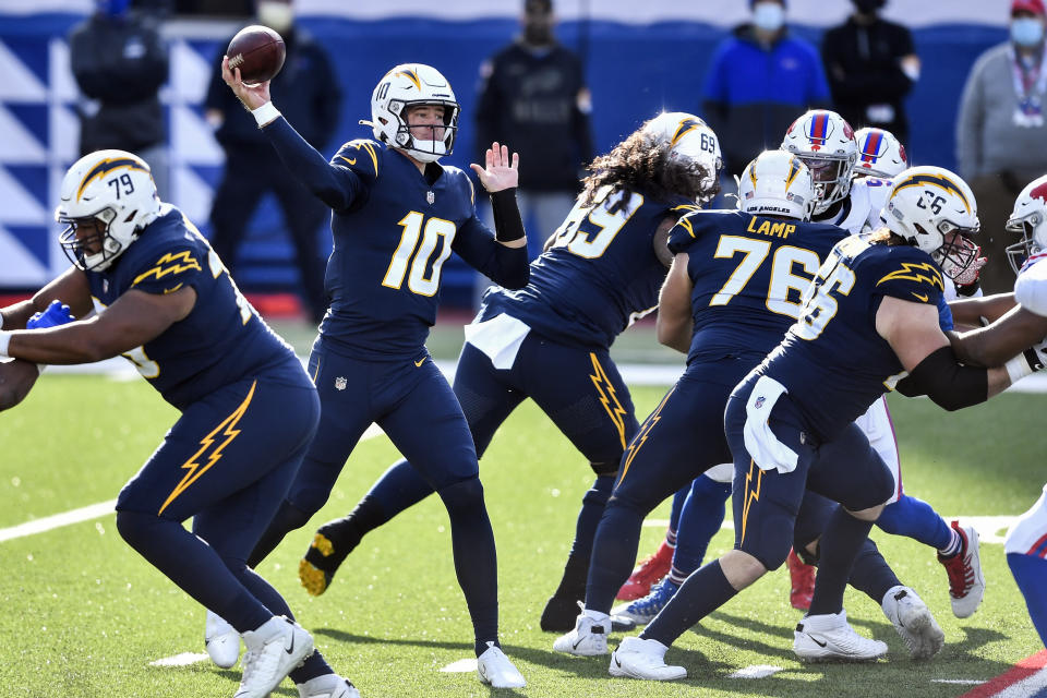 Los Angeles Chargers quarterback Justin Herbert (10) passes during the first half of an NFL football game against the Buffalo Bills, Sunday, Nov. 29, 2020, in Orchard Park, N.Y. (AP Photo/Adrian Kraus)