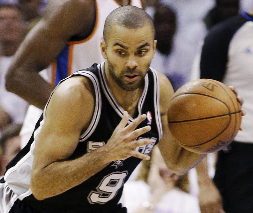 FILE - In this June 6, 2012 file photo, San Antonio Spurs point guard Tony Parker (9), of France, takes the ball downcourt past Oklahoma City Thunder small forward Kevin Durant during the first half of Game 6 in the NBA basketball Western Conference finals, in Oklahoma City. Parker says he suffered a scratched retina on one of his eyes during a New York City nightclub brawl involving singer Chris Brown and members of hip-hop star Drake's entourage. Parker, wearing dark sunglasses, described the incident Friday, June 15, 2012, in Paris during a news conference posted on YouTube. (AP Photo/Eric Gay, File)