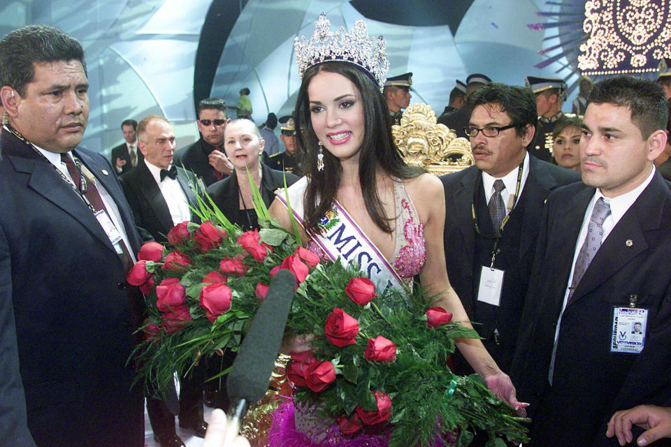 CARACAS, VENEZUELA:  Venezuelan Monica Spear is escort after being elected Miss Venezuela, in Caracas, 23 September 2004. Spear (19) is graduate in drama. AFP PHOTO/Andrew ALVAREZ  (Photo credit should read ANDREW ALVAREZ/AFP via Getty Images)