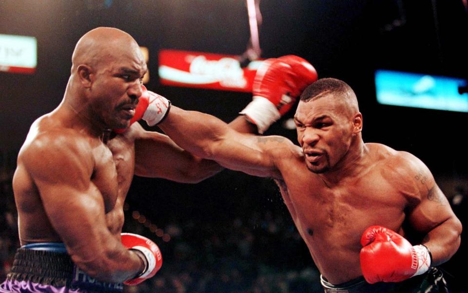 Mike Tyson lands a punch on Evander Holyfield in 1996 - Gary Hershorn REUTERS