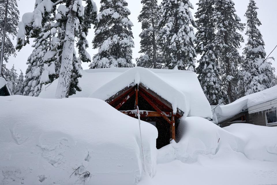 Homes are covered in snow during a powerful multiple day winter storm in the Sierra Nevada mountains, which is boosting the snowpack, on March 03, 2024 in Truckee, California (Getty Images)