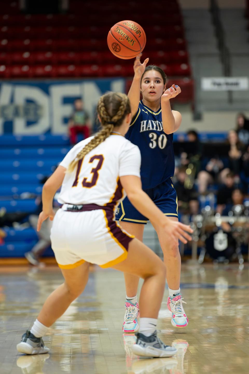 Hayden's guard Norma Greco (30) passes the ball during State Basketball March. 7, 2024 at Hutchinson Sports Arena.