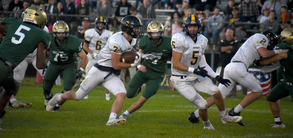 Jack Mills runs the ball during a 41-23 Airport vicotry on Friday, Sept. 15, 2023. Other players Nolan Zajac of Airport and Buddy Snodgrass (5), Eric Mathies (75) and Chase Terrasi of St. Mary Catholic Central.