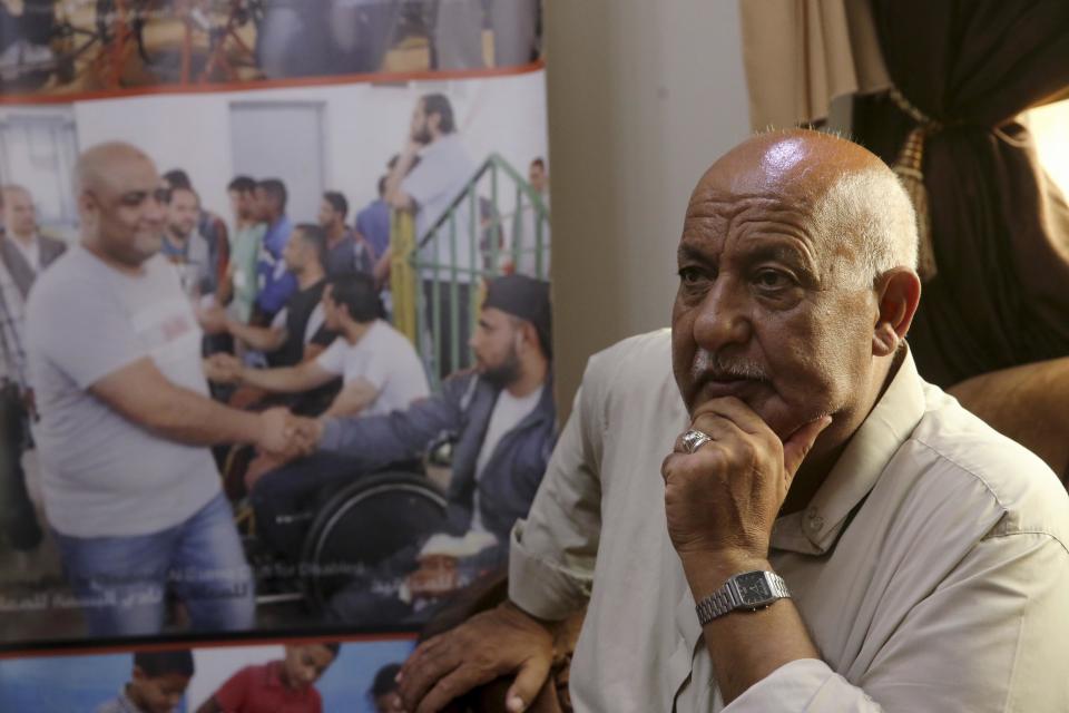 FILE - Khalil el-Halabi, the father of Mohammed el-Halabi, Gaza director of the international charity World Vision, who is detained and accused by Israeli security of diverting funds to Hamas, poses at his family house in Gaza City, Aug. 8, 2016. In May 2022, nearly six years after Israel accused Mohammed el-Halabi of diverting tens of millions of dollars from World Vision to Gaza's militant Hamas rulers, he has yet to be convicted in an Israeli court and is still being held in detention. World Vision — a major Christian charity that operates around the world — as well as independent auditors and the Australian government, have found no evidence of any wrongdoing. (AP Photo/Adel Hana, File)