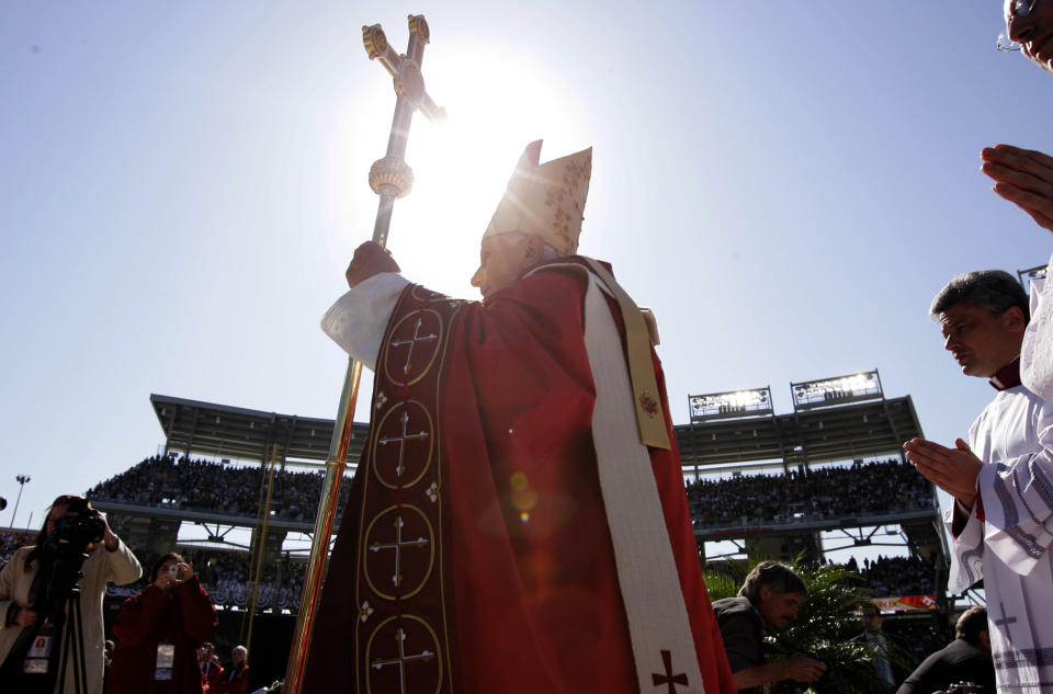 FILE - With the sun shining behind him, Pope Benedict XVI arrives to celebrates Mass, Thursday, April 17, 2008, at Washington Nationals baseball Park in Washington. Many of the conservative prelates who dominate the U.S. Conference of Catholic Bishops were appointed by Benedict. Even after his death in December 2022, Catholic academics and clergy say his absence is unlikely to weaken the conservatives' collective power or end the culture wars that have divided the USCCB. (AP Photo/Susan Walsh, File)