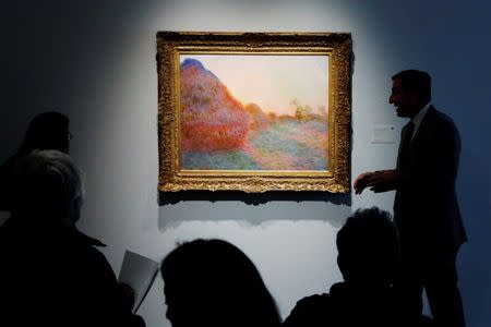 The painting by Claude Monet, part of the Haystacks "Les Meules" series is displayed at Sotheby's during a press preview of their upcoming impressionist and modern art sale in New York, U.S., May 3, 2019. REUTERS/Lucas Jackson