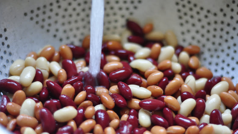 rinsing beans in colander