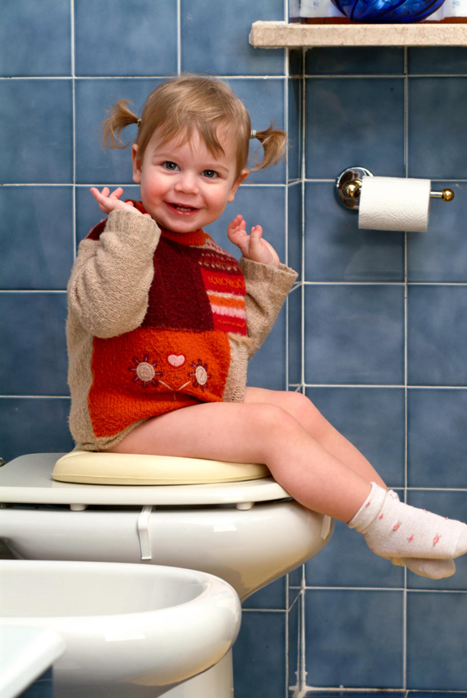 Little girl on potty. (Shutterstock  )