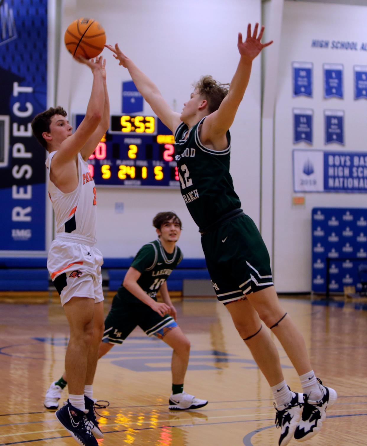 Landon Dempsey of Bradenton Christian School looks to shoot over Connor "CJ" Kerr of Lakewood Ranch High during the Ascenders Classic on Friday evening at IMG Academy in Bradenton.