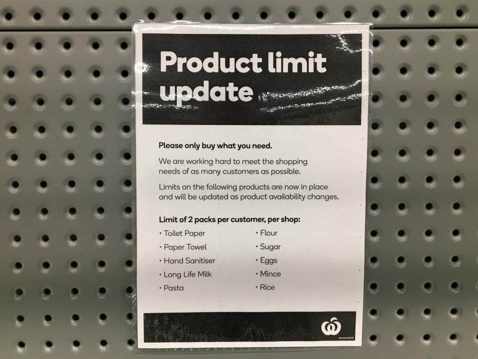 Signage for product limits is seen on a shelf in a Woolworths Supermarket in Melbourne.