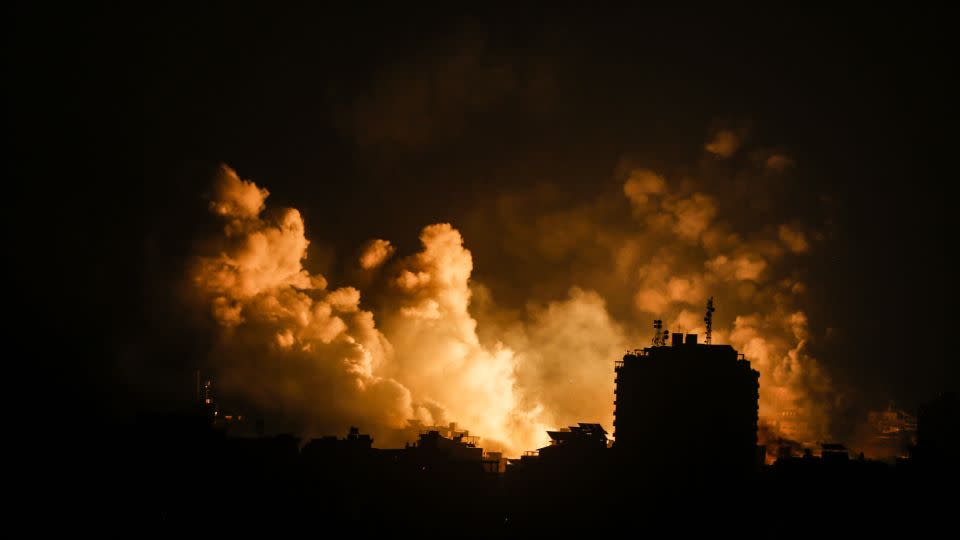 Smoke rises over buildings in Gaza City on October 9, during an Israeli air strike.
 - Sameh Rahmi/NurPhoto/Shutterstock