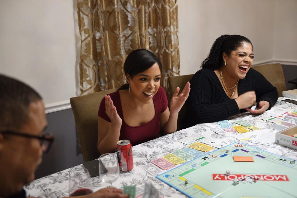 Celinda Ortega, Miss New Jersey USA 2021, shares a laugh as she plays Monopoly together with  her family at their home in Fair Lawn, Thursday, March 10, 2022.