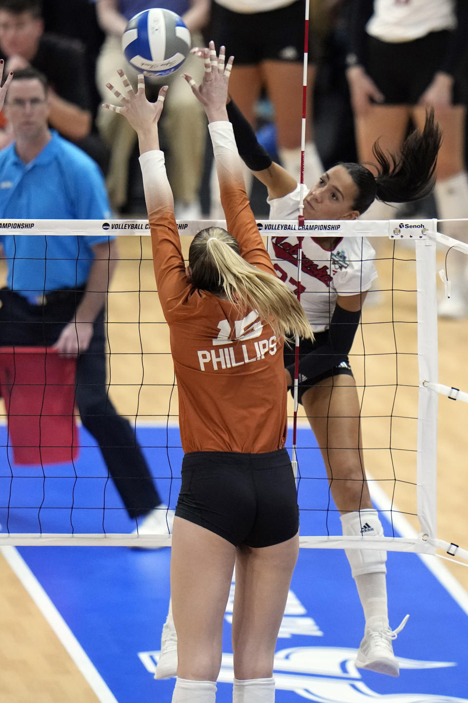 Nebraska's Harper Murray (27) scores past Texas's Molly Phillips (15) during the championship match in the NCAA Division I women's college volleyball tournament Sunday, Dec. 17, 2023, in Tampa, Fla. (AP Photo/Chris O'Meara)