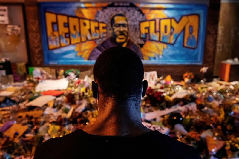 FILE PHOTO: A man recites spoken word poetry at a makeshift memorial honoring George Floyd