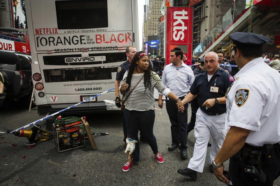 Double-decker tour buses collide in Times Square