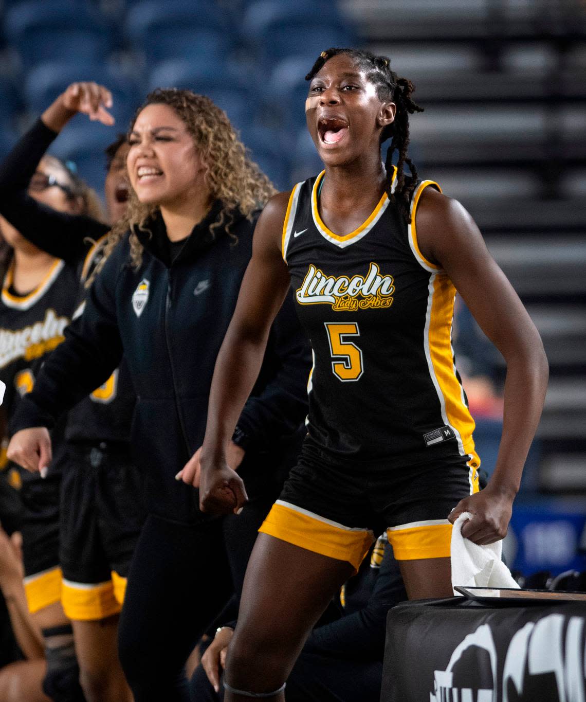 Lincoln’s Oliviyah Edwards celebrates an Abes rally during their state quarterfinal game against the Lake Washington Kangaroos at the WIAA state basketball tournament in the Tacoma Dome in Tacoma, Washington, on Wednesday, March 1, 2023. Lake Washington won the game, 57-52.