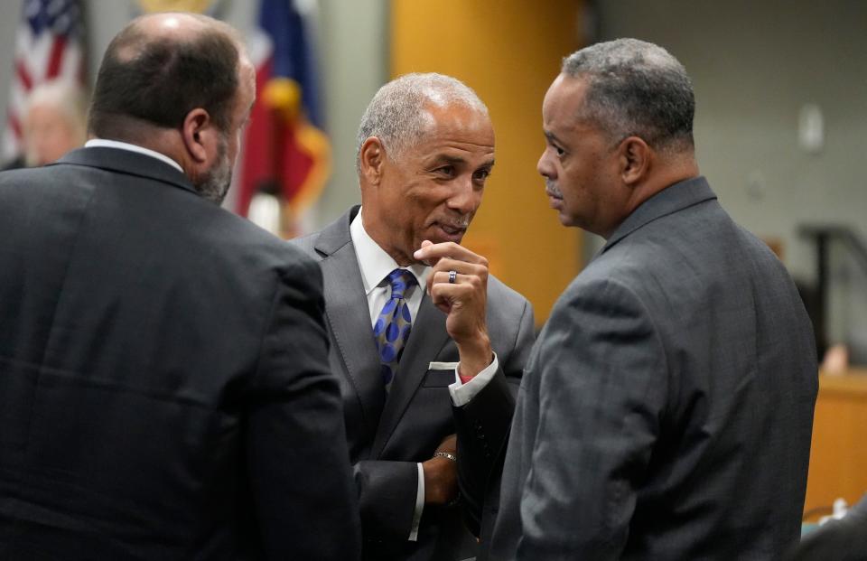 Prosecutors Rob Drummond, left to right, Gary Cobb and Dexter Gilford talk among themselves during the murder trial of Austin Police Officer Christopher Taylor at the Blackwell-Thurman Criminal Justice Center on Monday October 23, 2023. Taylor is charged with killing of Michael Ramos in 2020.