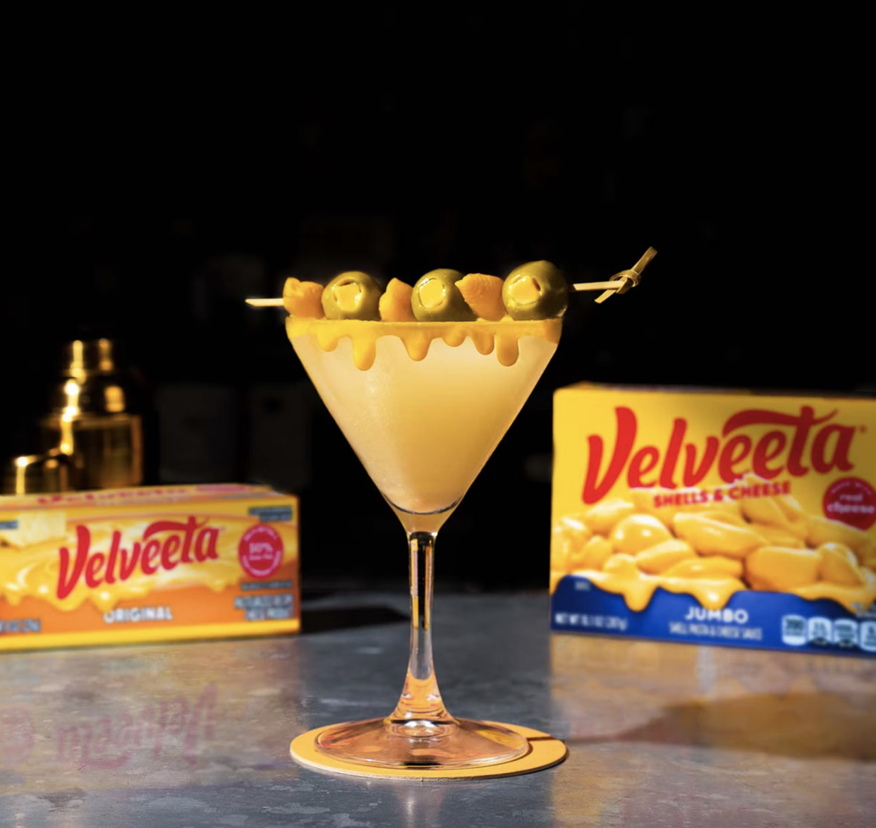 Cheesy martini with velveeta packages in background