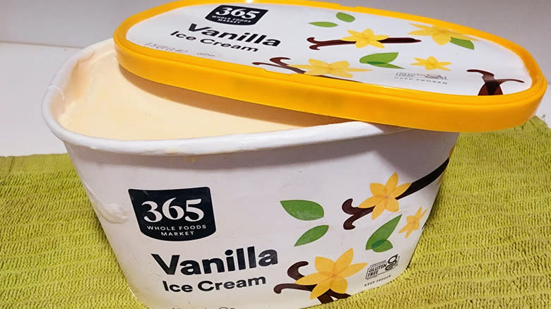 Open tub of vanilla ice cream