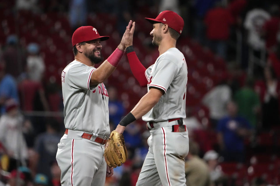 Philadelphia Phillies' Kyle Schwarber, left, and teammate Trea Turner celebrate a 6-1 victory over the St. Louis Cardinals following a baseball game Saturday, Sept. 16, 2023, in St. Louis. (AP Photo/Jeff Roberson)